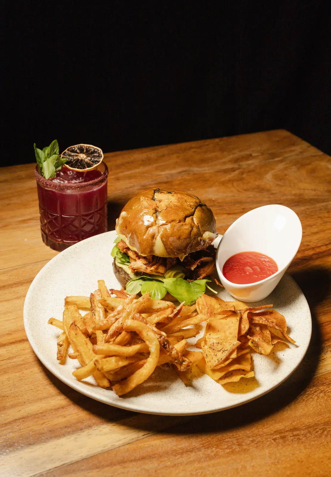 Pork burger with chile adobo and a tequila cocktail at Rosanta, gastro cocktail restaurant in Antigua Guatemala