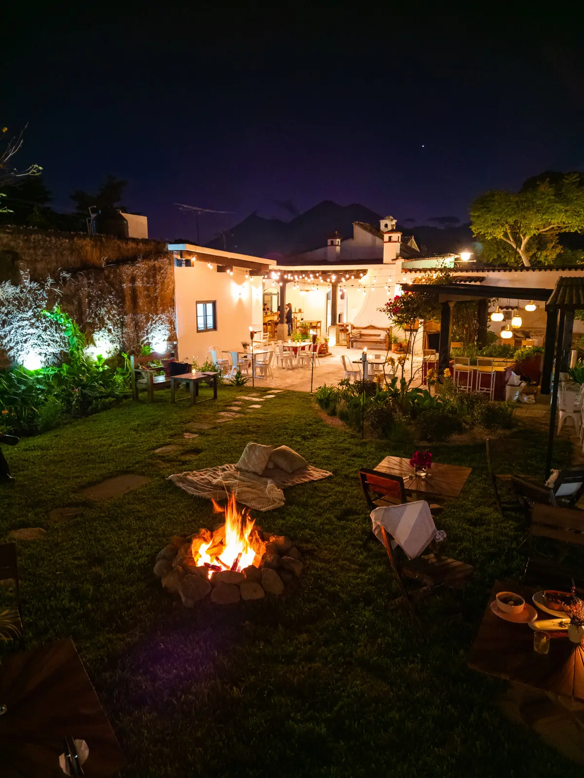 Firepit lit at night in the Rosanta garden, Antigua Guatemala