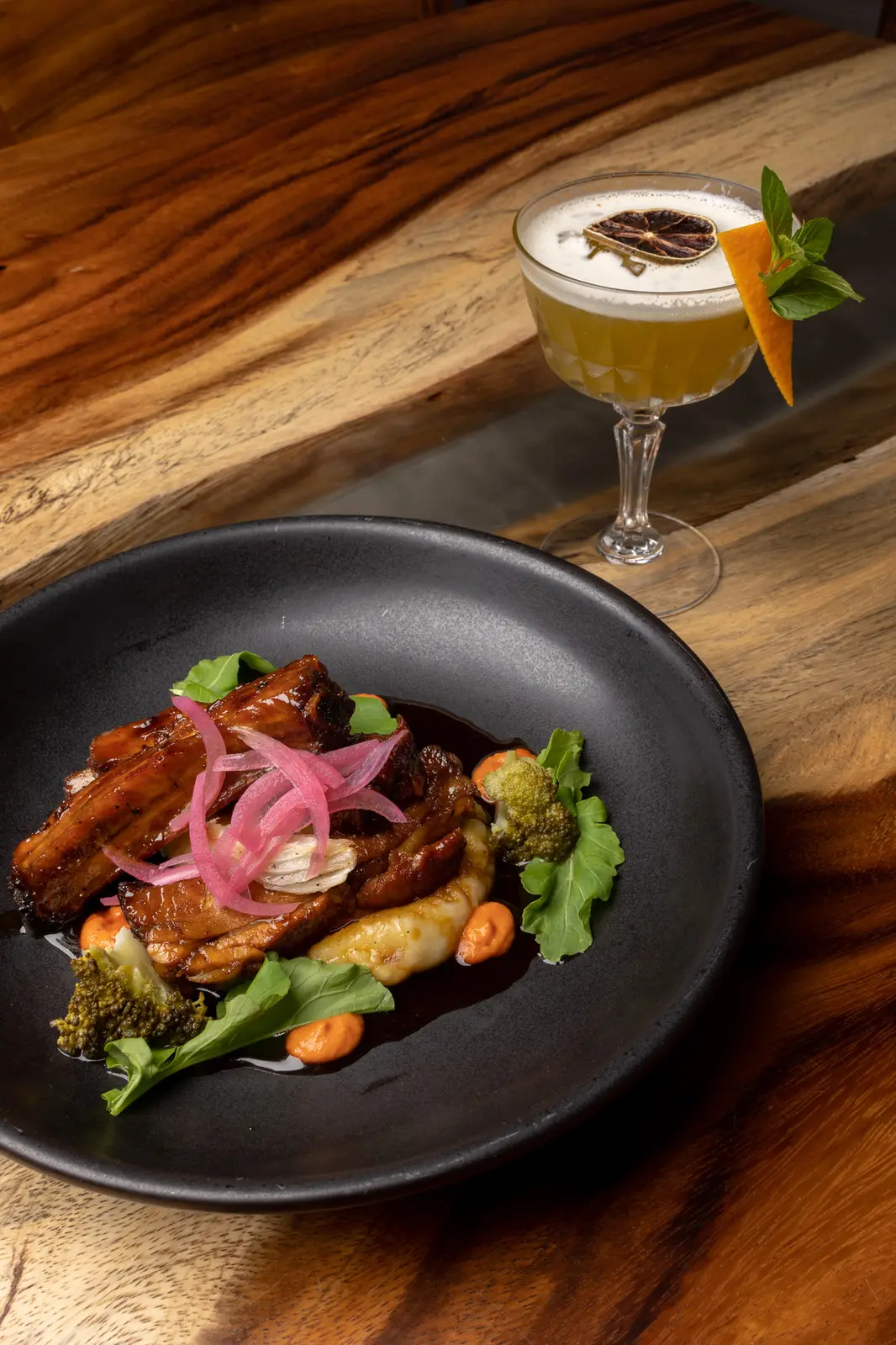 Slow-baked pork ribs with a whiskey cocktail at Rosanta in Antigua Guatemala