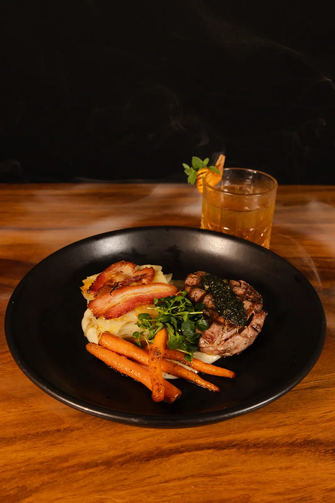 Grilled tenderloin with potato gratin and a Red Pepper Old Fashioned cocktail at Rosanta, Antigua Guatemala