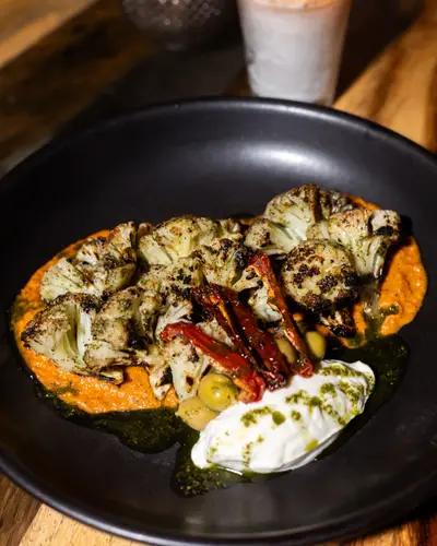 Grilled cauliflower over romesco sauce